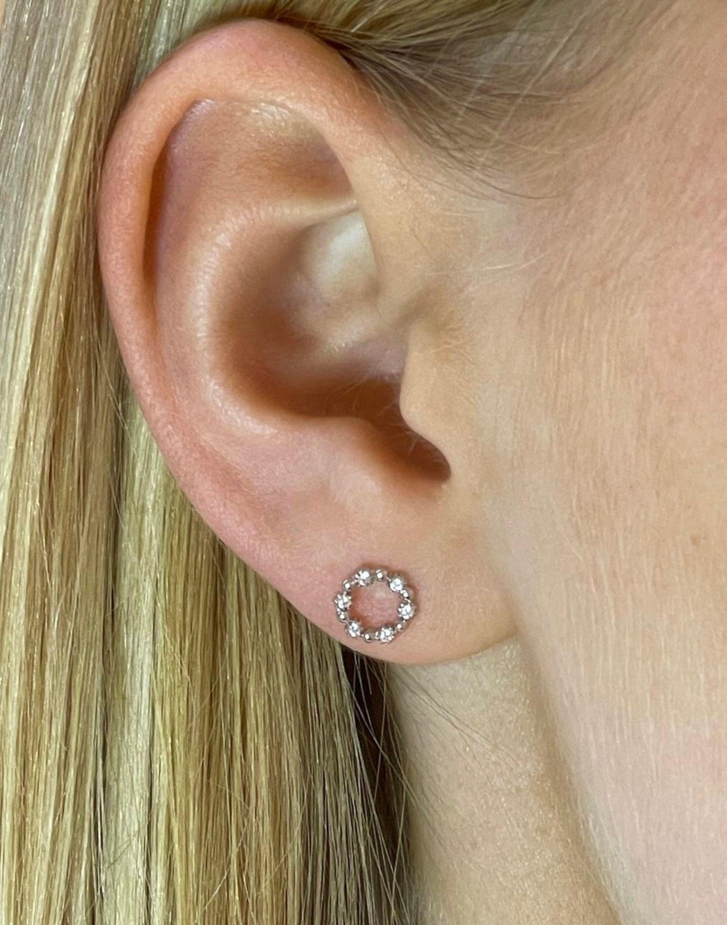 model wears silver cubic zirconia circle stud earrings