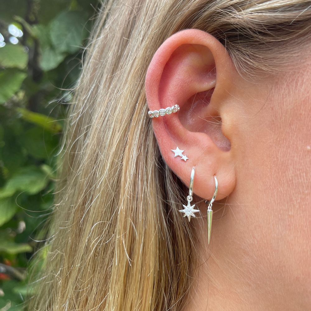 model wears silver cubic zirconia ear cuff