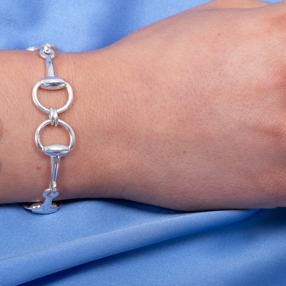 
                  
                    luxury silver snaffle bracelet on wrist
                  
                