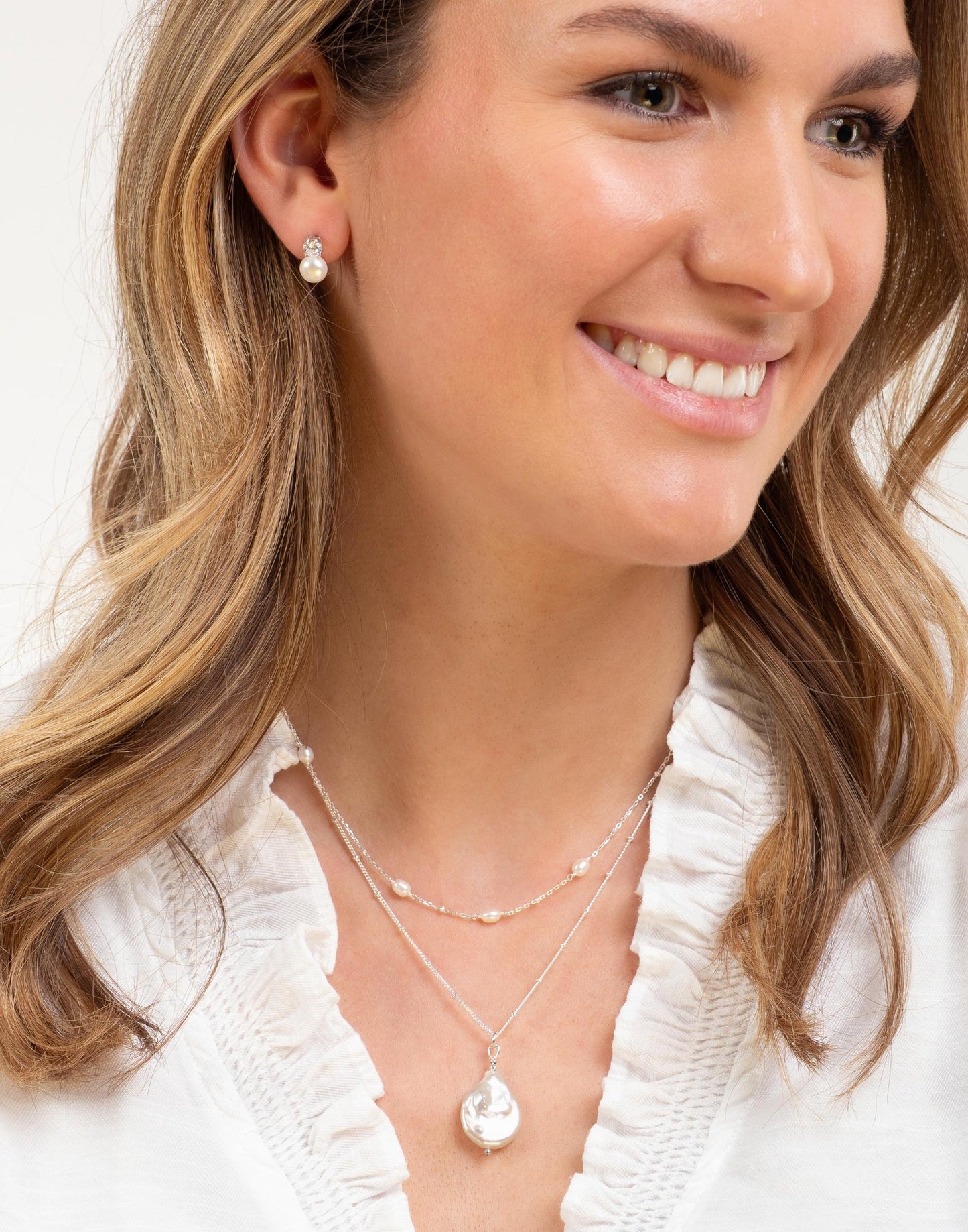 model wears pearl layering set