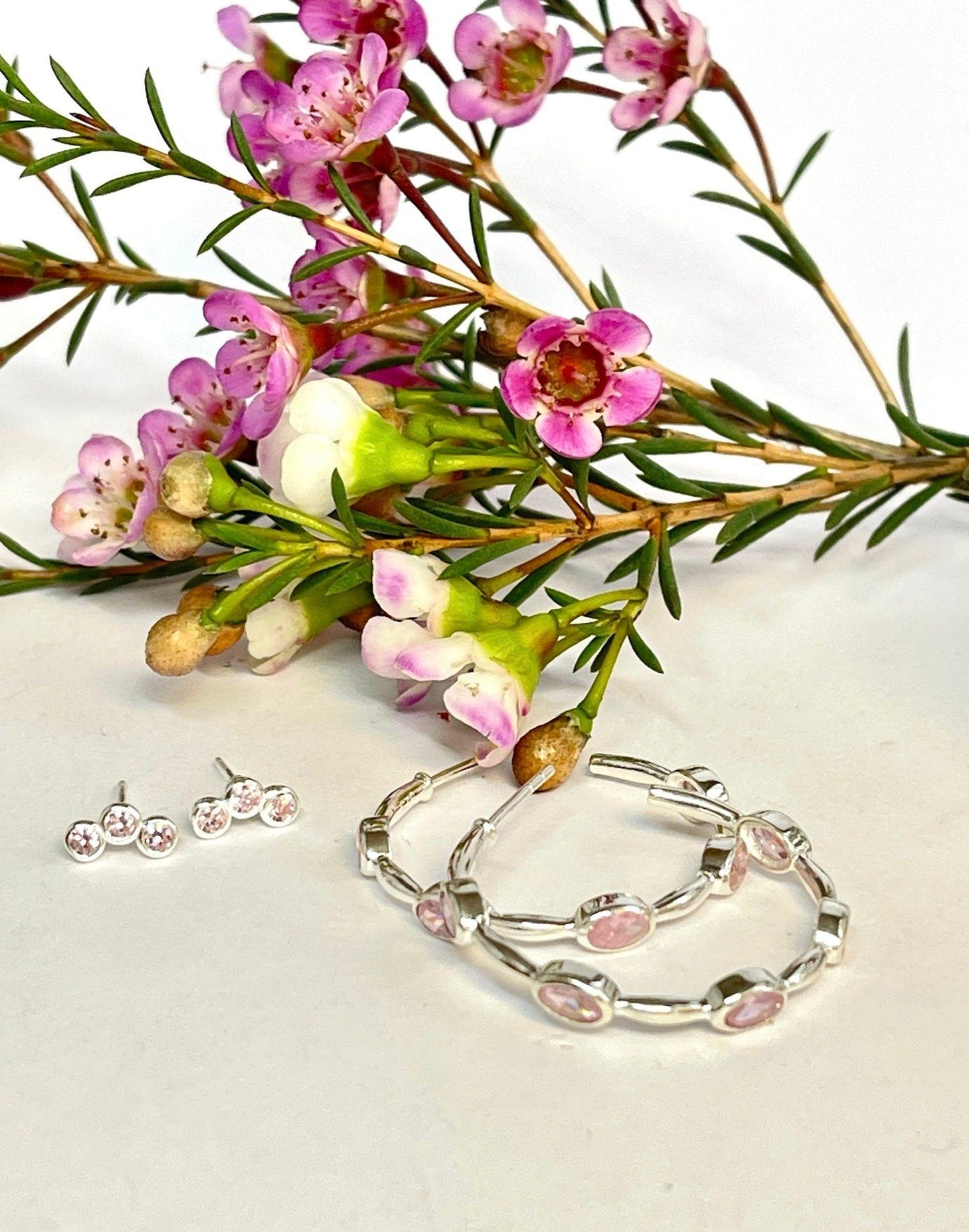 Triple Cubic Zirconia Pink and silver stud earring with silver hoops and flowers