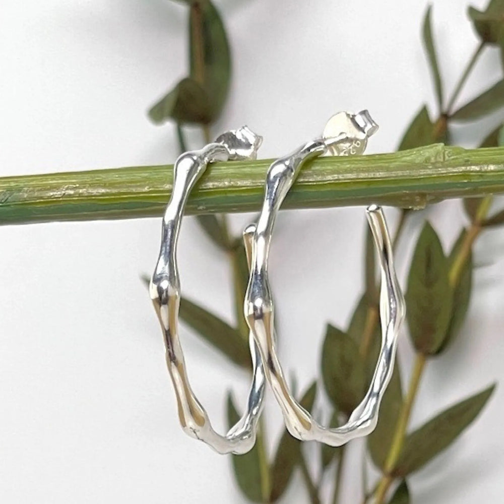 
                  
                    Zelda Silver Bamboo Hoop Earrings in flowers
                  
                
