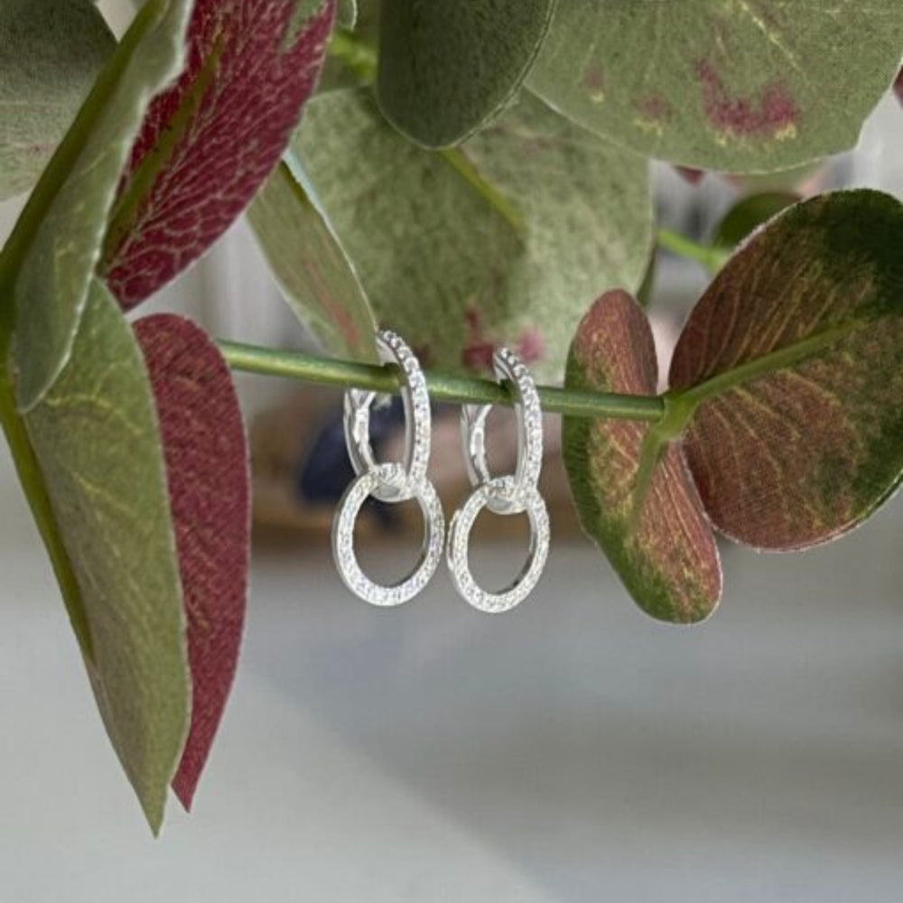 
                  
                    cz silver circle huggie earrings with flowers
                  
                