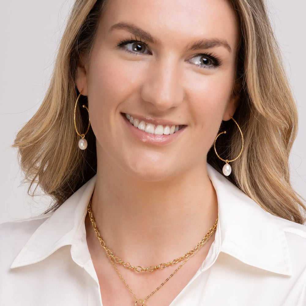 large pearl hoops with pearl drop on model