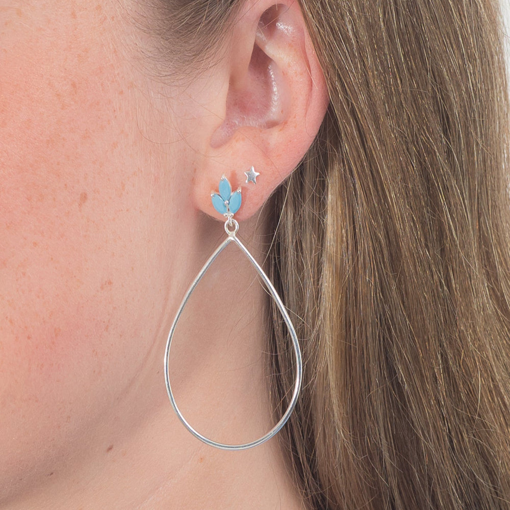 
                  
                    Lotus flower silver turquoise drop earrings in ear
                  
                