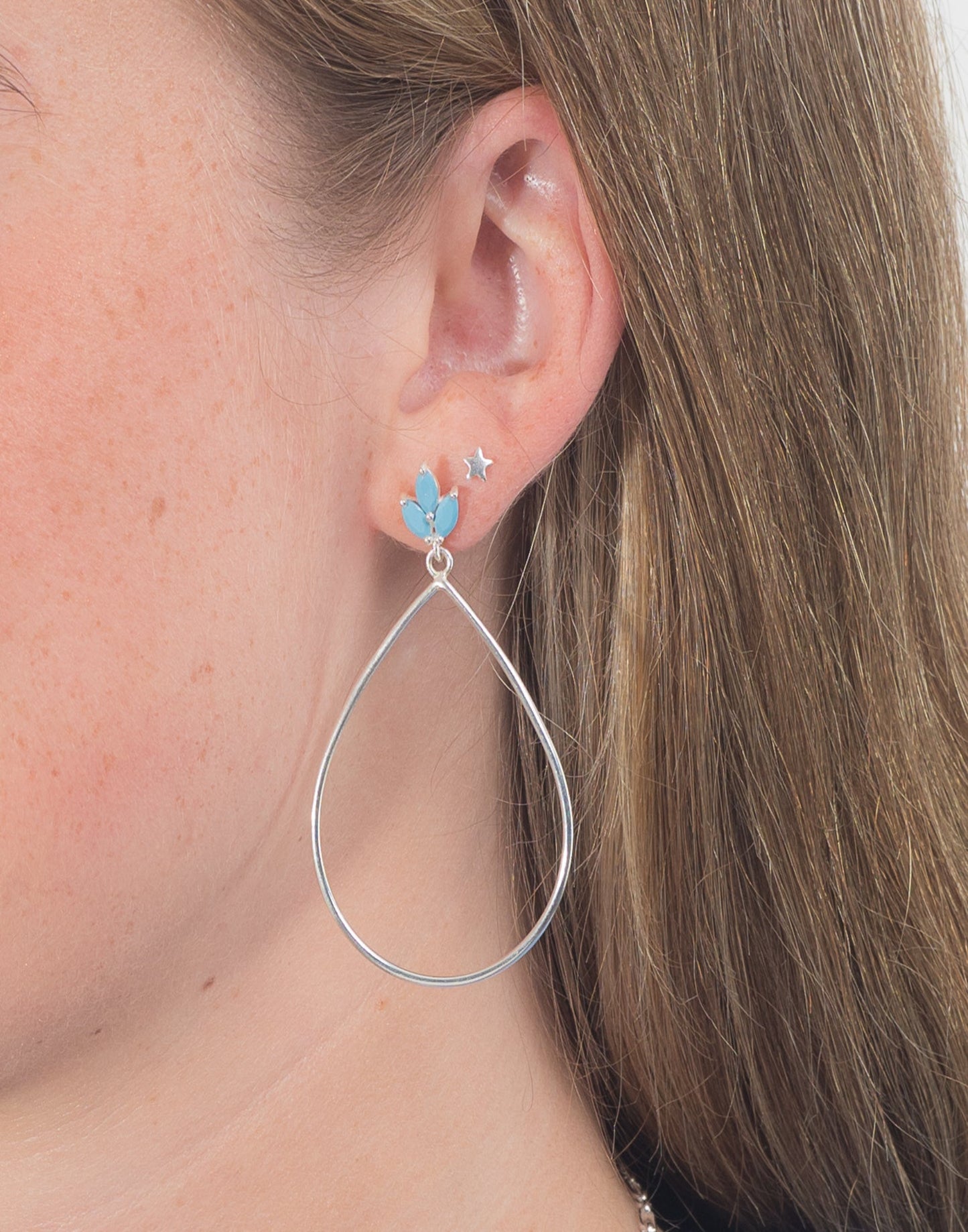 Lotus flower silver turquoise drop earrings in ear