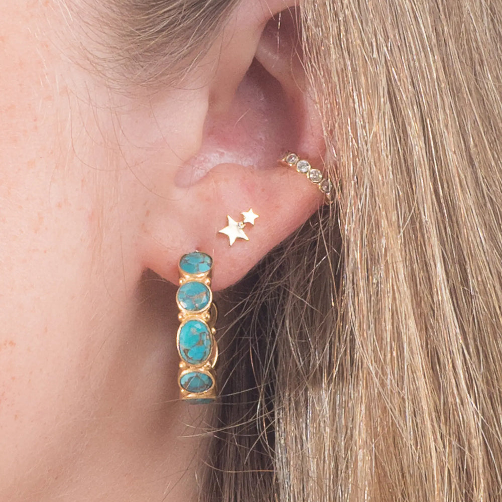 model wears mojave hoops in earring stack