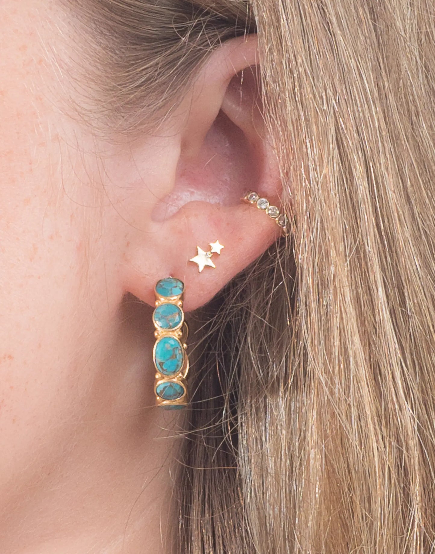 model wears mojave hoops in earring stack