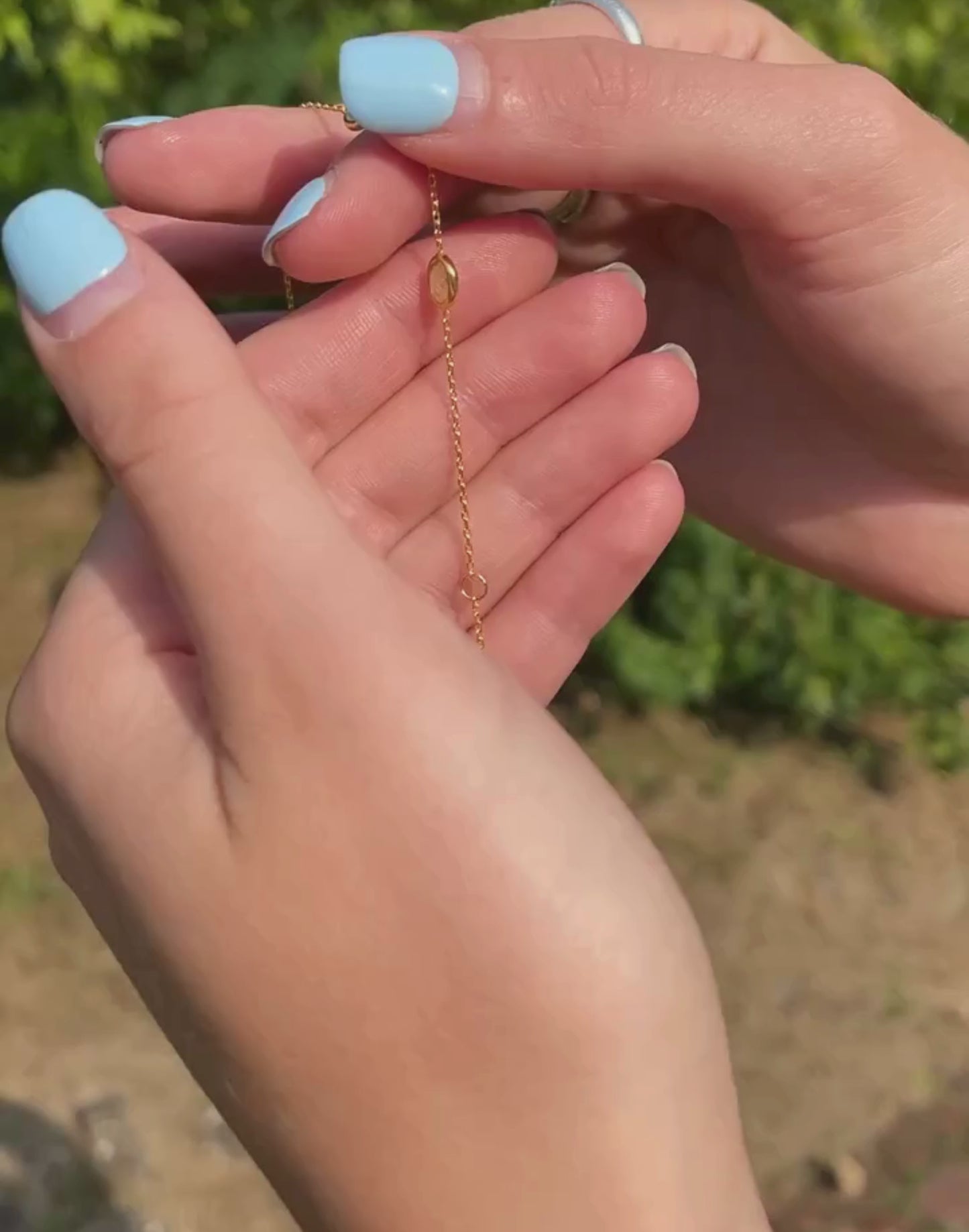 Model shows gold peridot bracelet