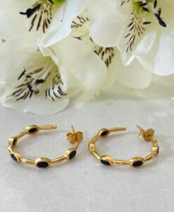 Black Onyx Gold Hoop Earrings on table