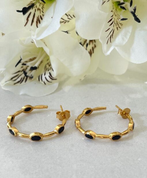 Black Onyx Gold Hoop Earrings on table