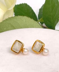 Pearl and Prehnite Stud Earrings on table