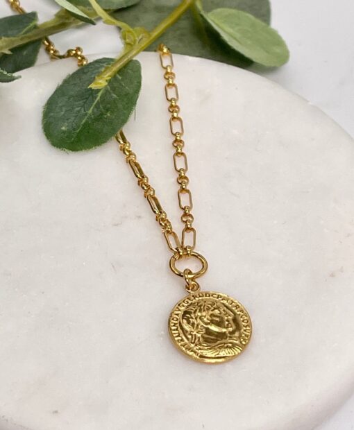 Gold Coin Necklace on tile