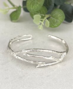 Twig brushed silver cuff on tile